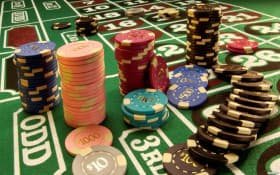 Mobile phone showing pelangi4d login Quickspin casino interface with live dealer tables and slot games